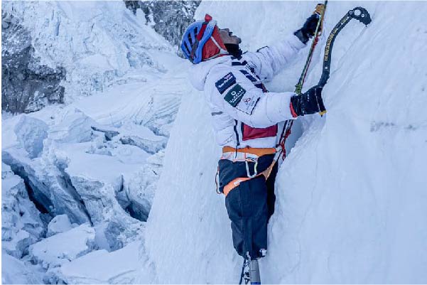 Hari climbing a wall of ice on Mount Everest