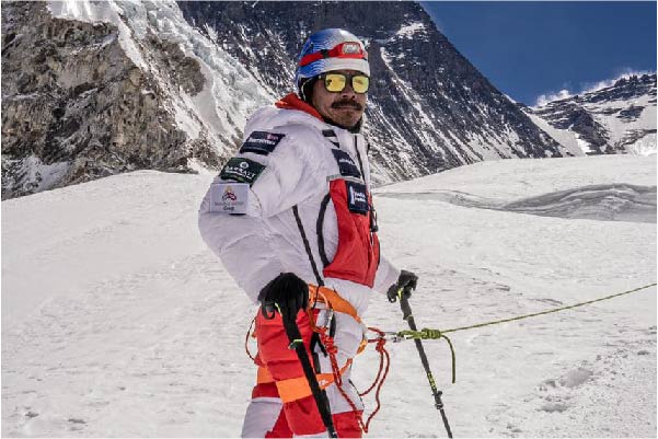 Hari Budha Magar on Mount Everest wearing a snow suit