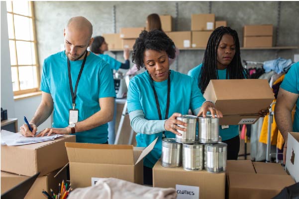 Volunteers working at a charity donation centre